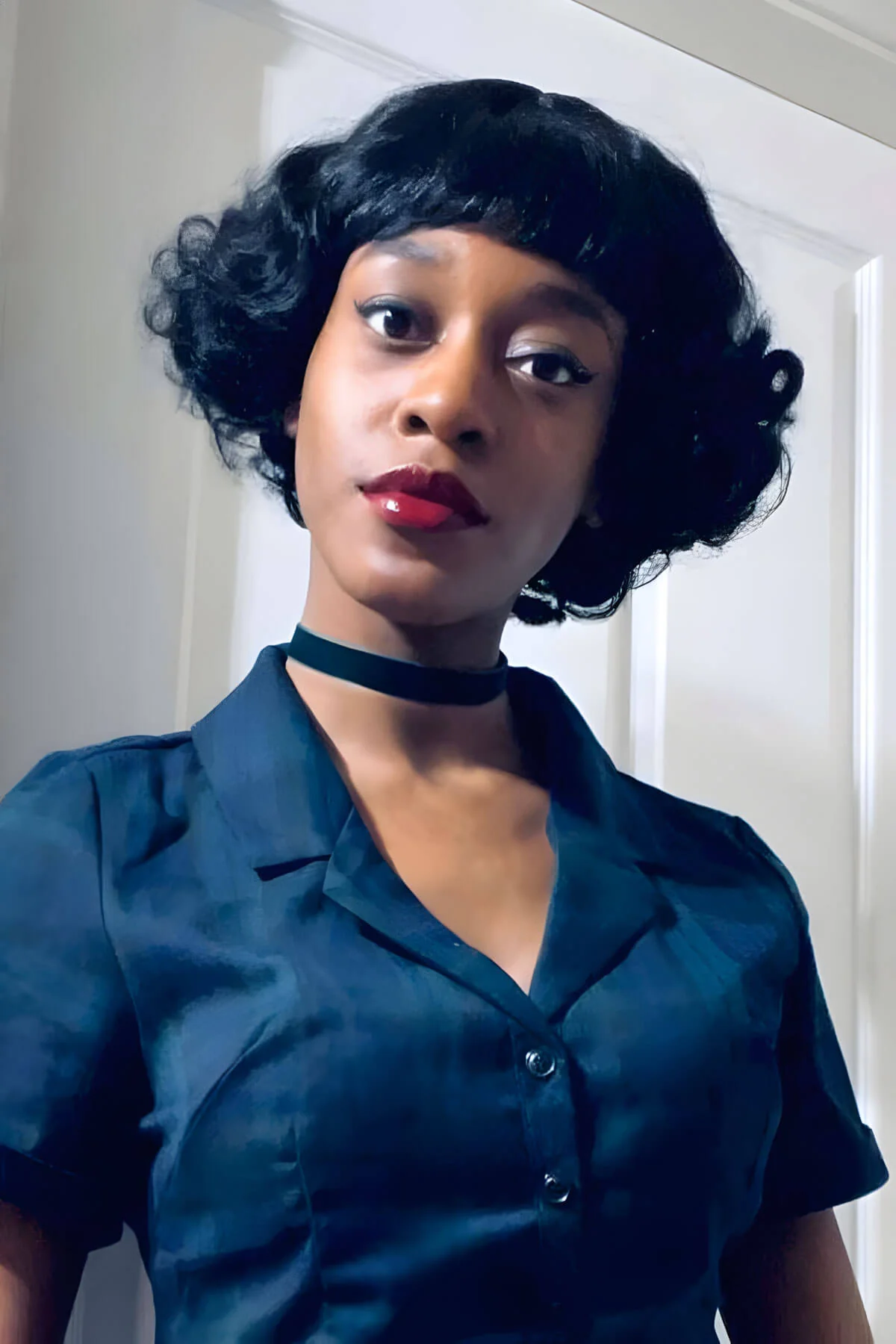 A short black vintage style wig with finger waves: Marlene