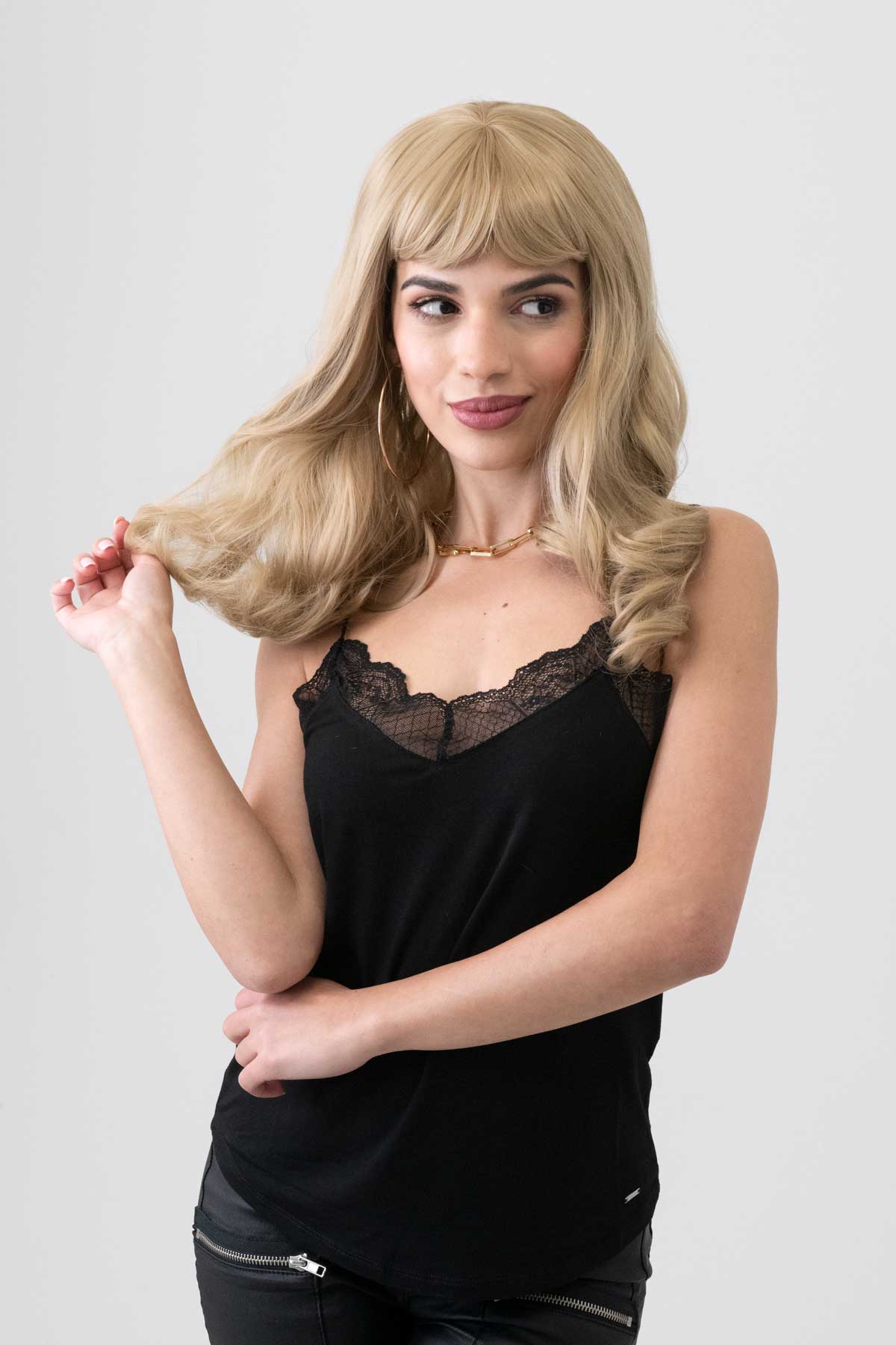 Long, ash blonde wig with short fringe and gentle waves: Trinity - Image 3