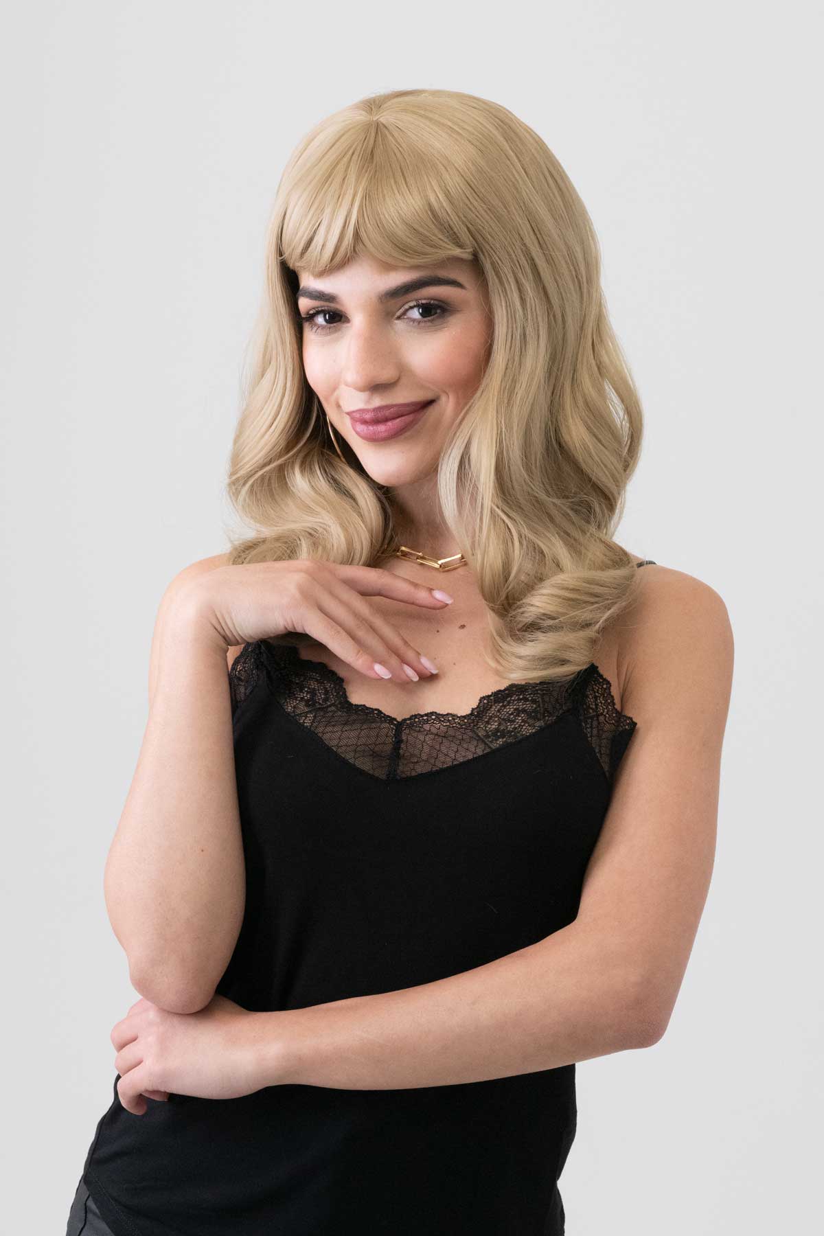 Long, ash blonde wig with short fringe and gentle waves: Trinity - Image 5