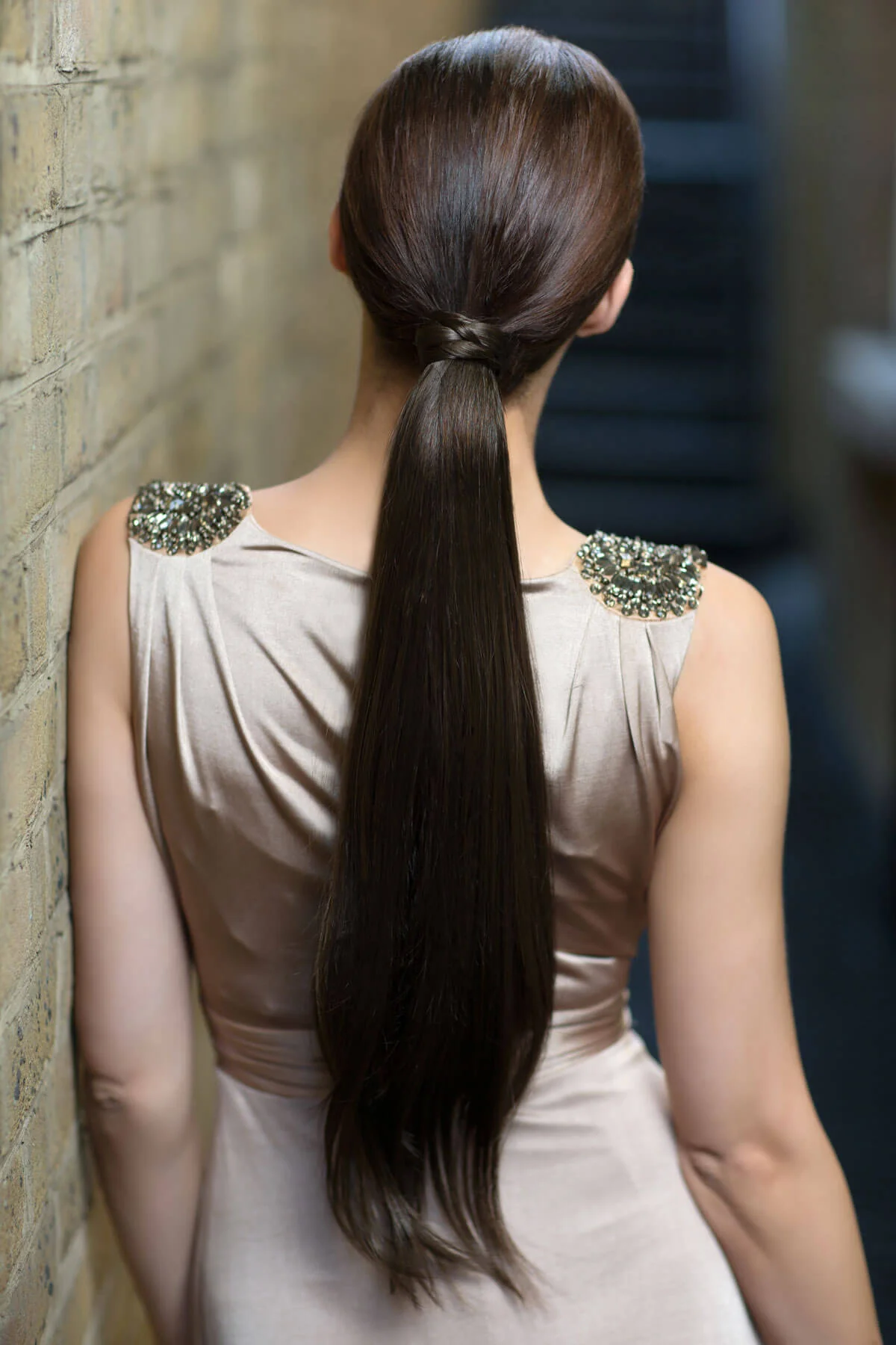Long sleek ponytail extension with gentle, layered waves: Mali